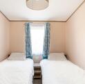 Regal Charmouth holiday home for sale at Discover Parks - twin bedroom photo