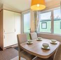Willerby Avonmore holiday home for sale on riverside plot at Arrow Bank. Dining area photo