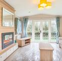Willerby Avonmore holiday home for sale on riverside plot at Arrow Bank. Lounge photo