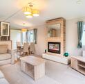 Willerby Avonmore holiday home for sale on riverside plot at Arrow Bank. Living area photo