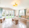 Willerby Avonmore holiday home for sale on riverside plot at Arrow Bank. Lounge photo