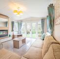 Willerby Avonmore holiday home for sale on riverside plot at Arrow Bank. Lounge photo