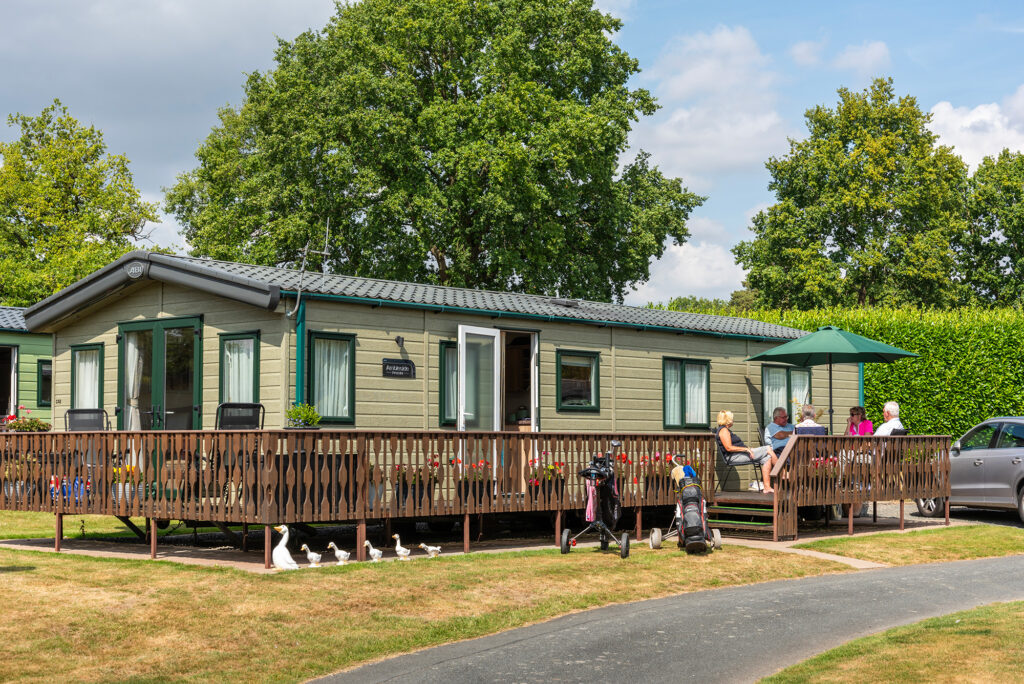 Owners on caravan decking
