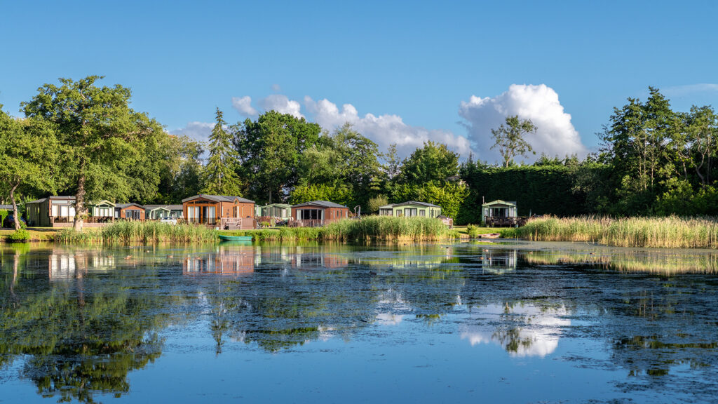 Lake edge holiday homes at Pearl Lake country holiday park in Herefordshire.