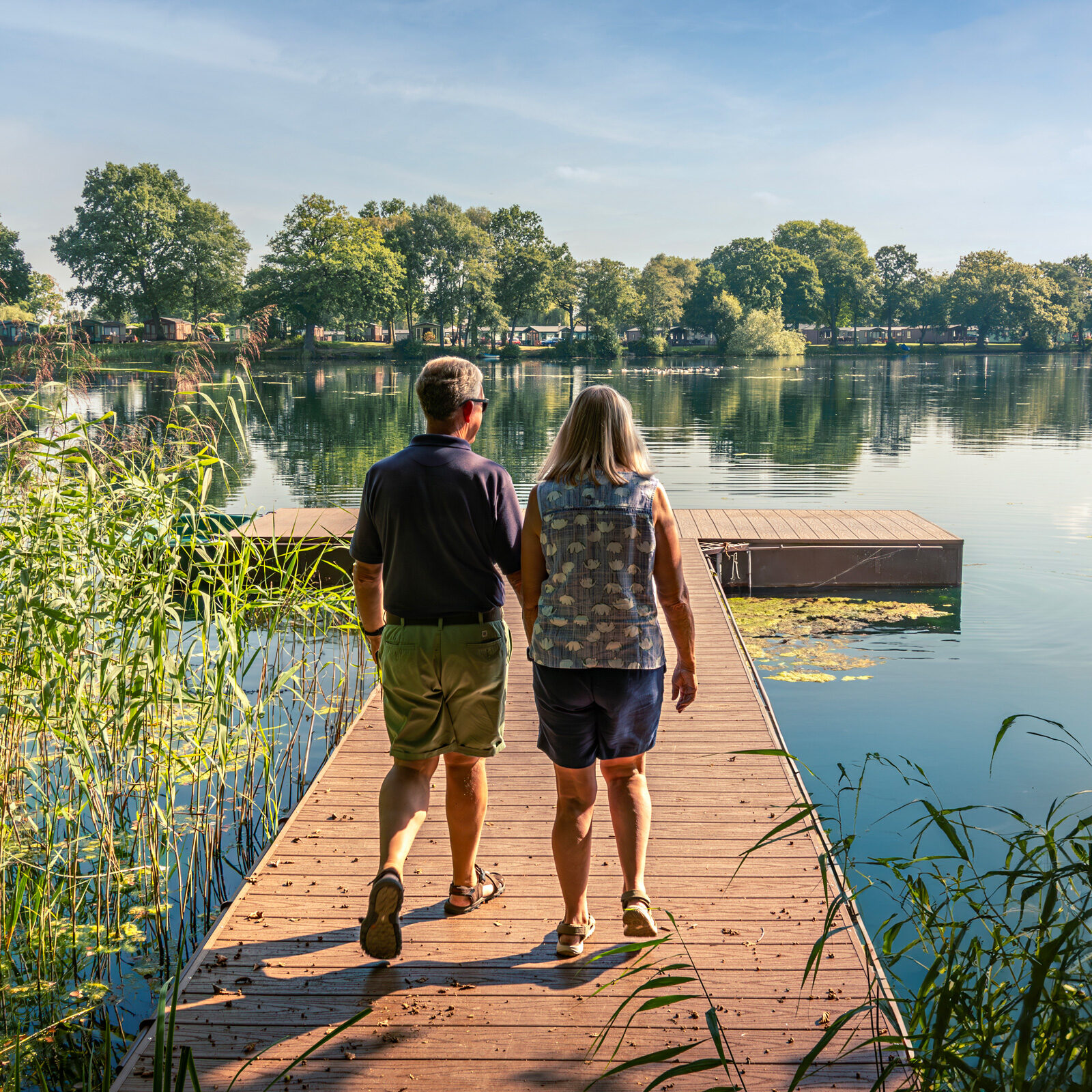 Happy Couple Looking at Lake - Discover Parks