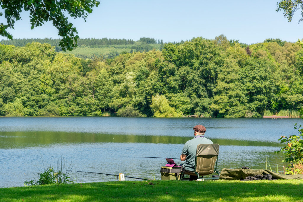 Carp fishing lake at Pearl Lake holiday park, Herefordshire. Fisherman photo