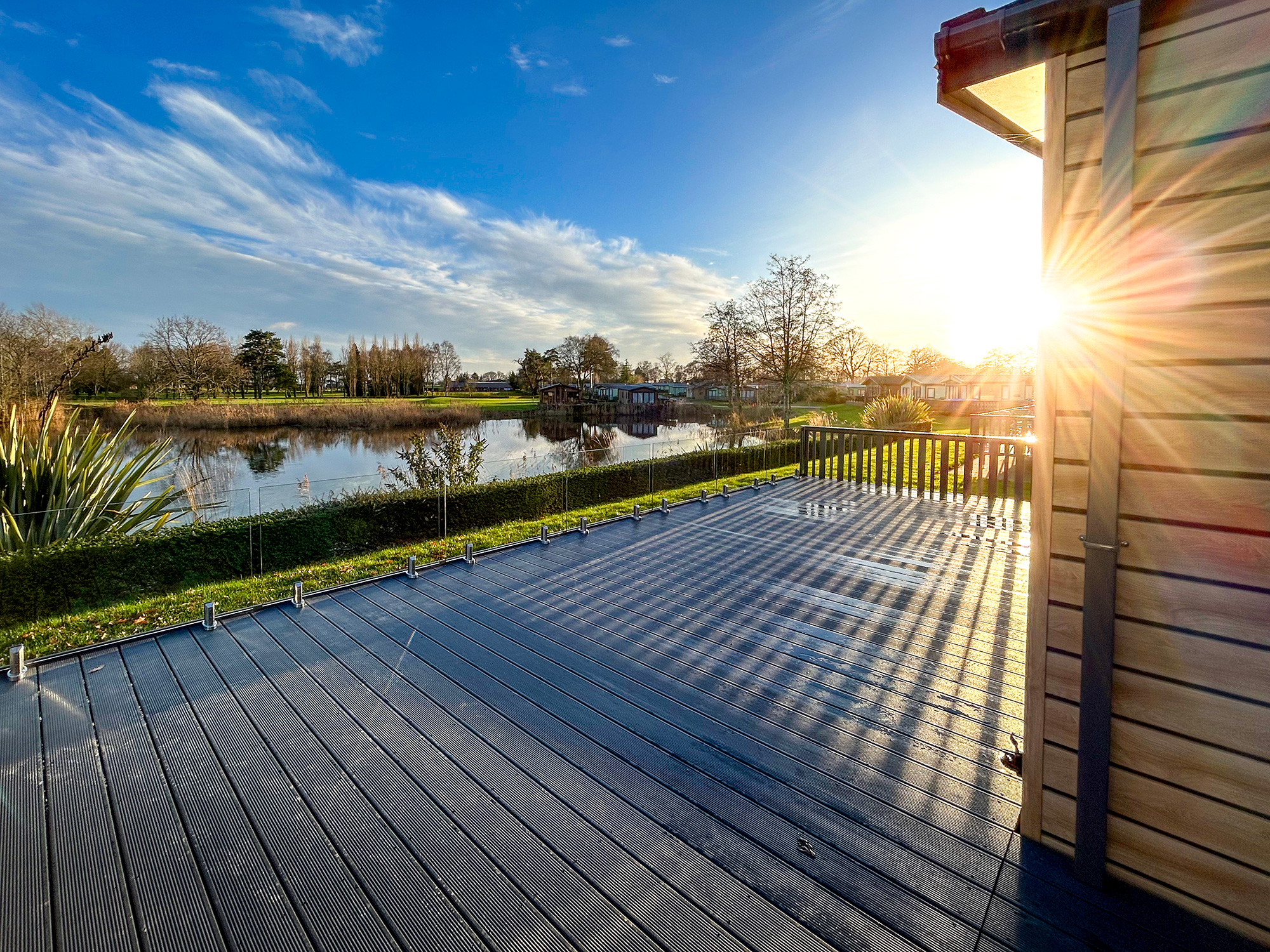 Pemberton Skydale for sale on lake edge plot at Pearl Lake. View from decking photo