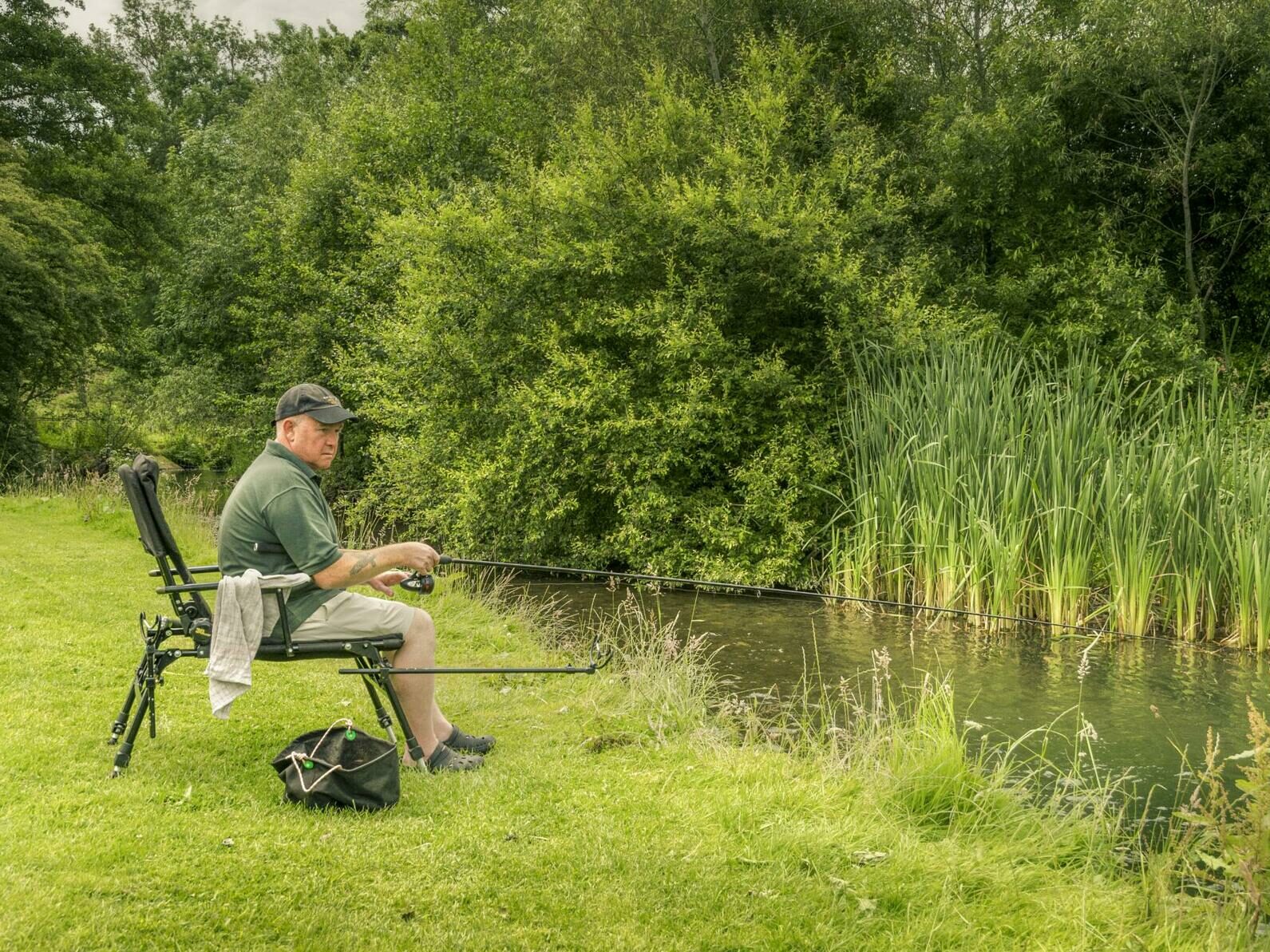 Riverside touring holiday park with river fishing, Wales.