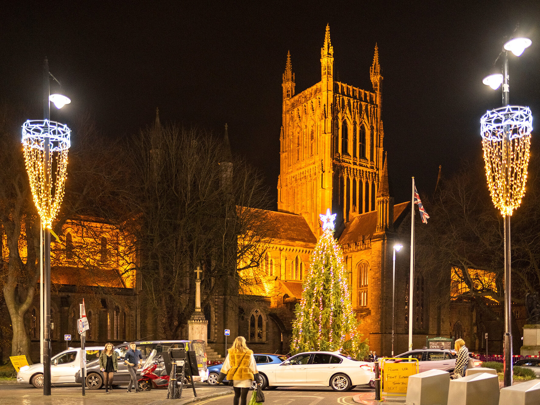 Worcester Cathedral lit up at night with a Christmas tree and festive lights during Worcester Christmas Market.