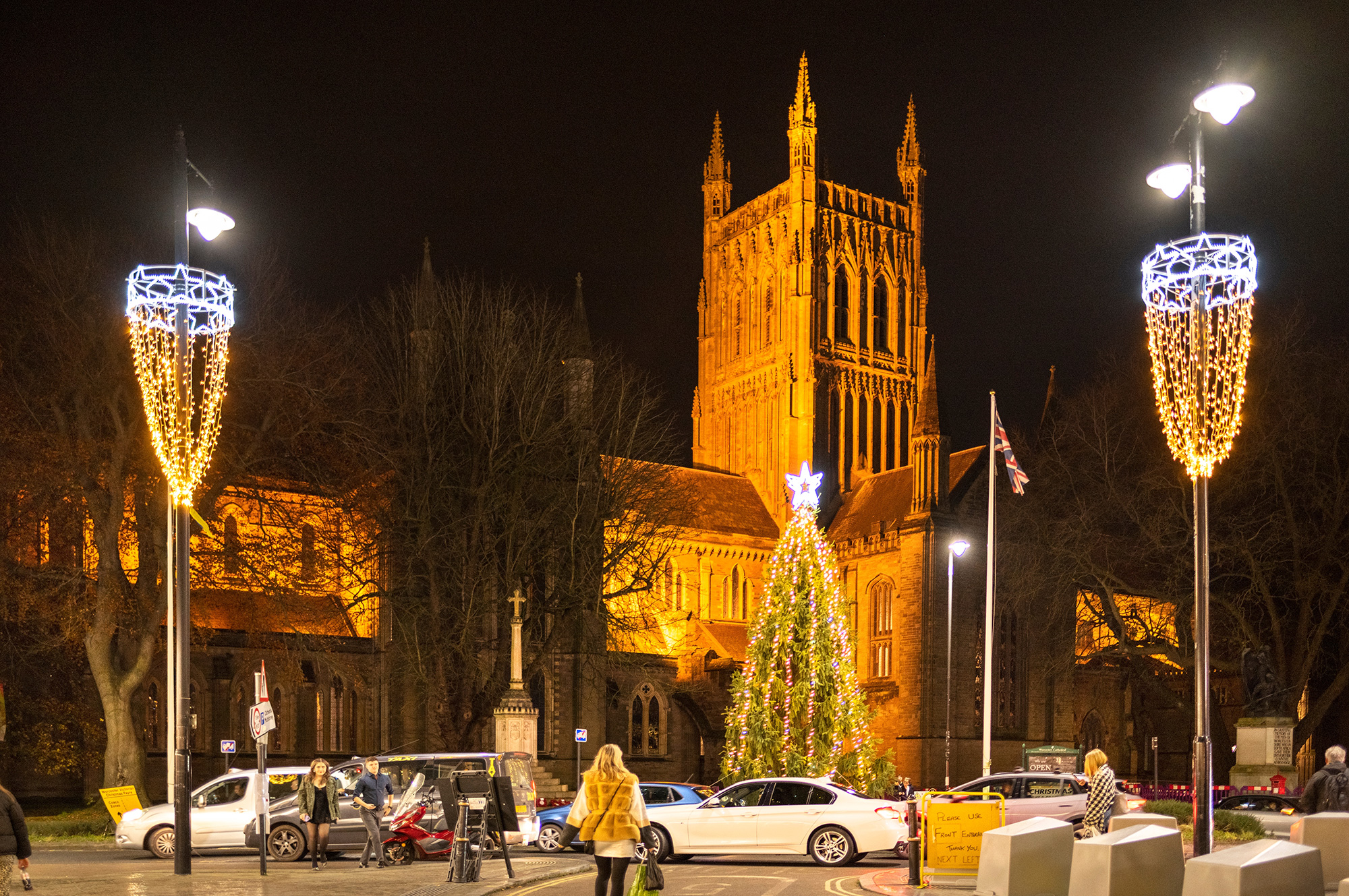 Worcester Cathedral lit up at night with a Christmas tree and festive lights during Worcester Christmas Market.
