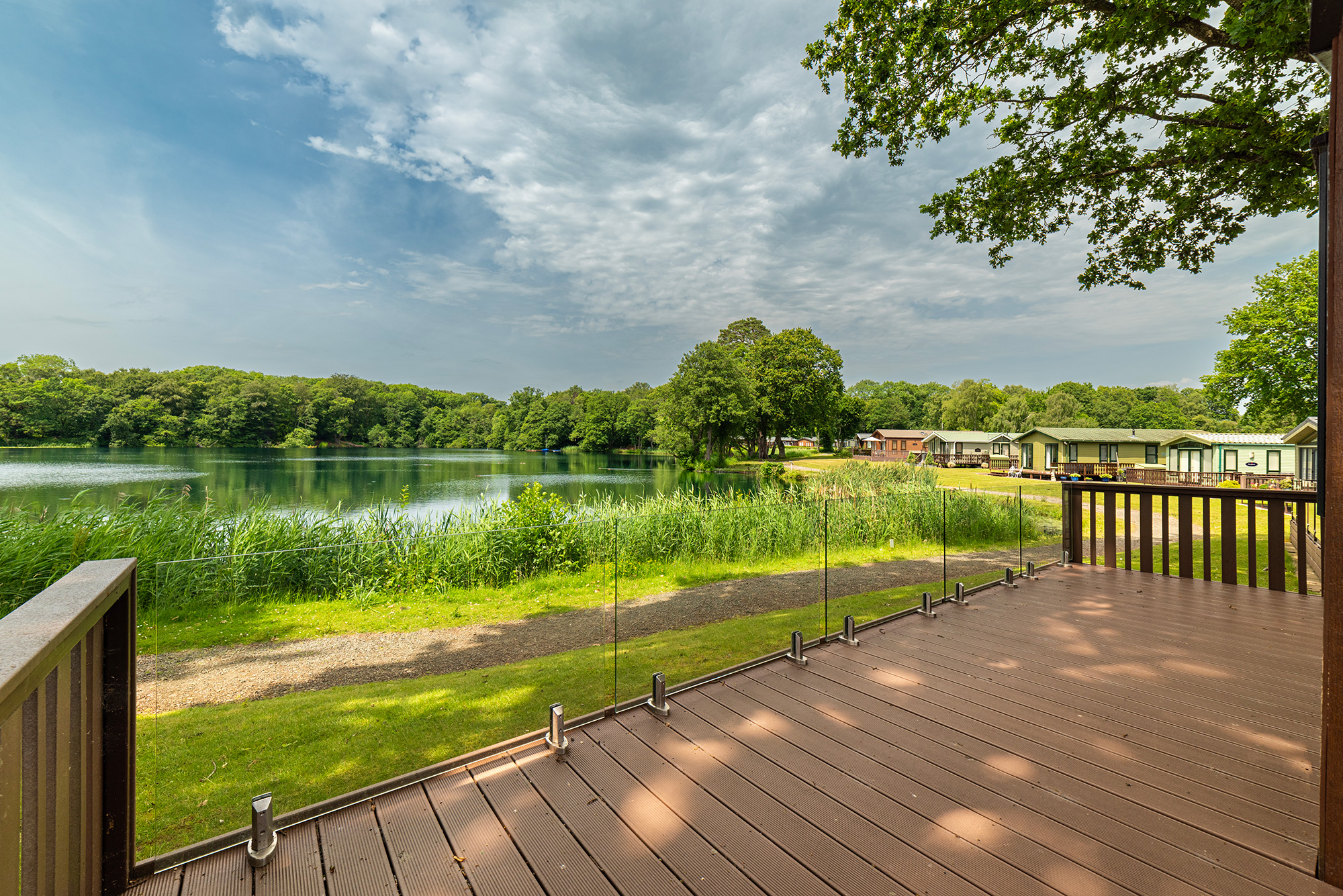 ABI Westwood holiday home for sale at Pearl Lake Country Holiday Park. Decking and lake photo.